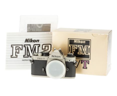 A Nikon FM2T Titanium SLR Body, 1994, titanium, serial no. 9003997, body, VG, shutter working, complete with paperwork and ma