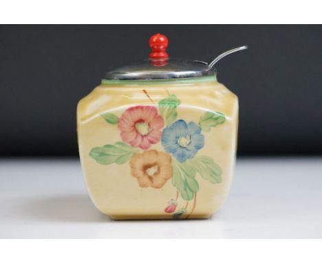 Clarice Cliff for Newport Pottery - Preserve jar with floral and green banding decoration, on a mustard yellow ground, with m