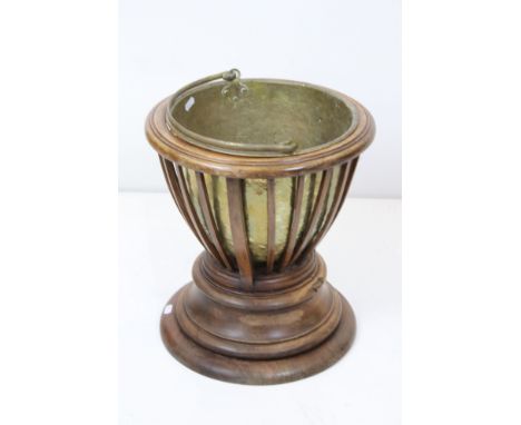 19th century Mahogany Coal Bucket / Jardiniere with slatted sides and circular plinth base, brass liner, with plaque ' This w