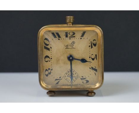 A brass cased Art Deco French made travel alarm clock.