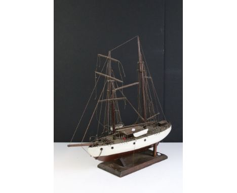 A vintage kit built twin mast wooden ship on stand. 