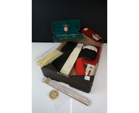 Pocket Barometer by Negretti and Zambra with a collection of slide rule scales, drawing instruments, pen nib, etc 