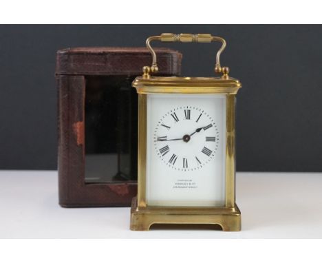 A brass cased carriage clock with bevelled glass panels, the dial marked Hawley &amp; Co of Regent St. London, complete with 