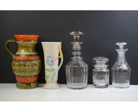 Clarice Cliff Vase with moulded relief flower decoration, shape no. 905, 22cm high together with a West German Pottery Jug, 1