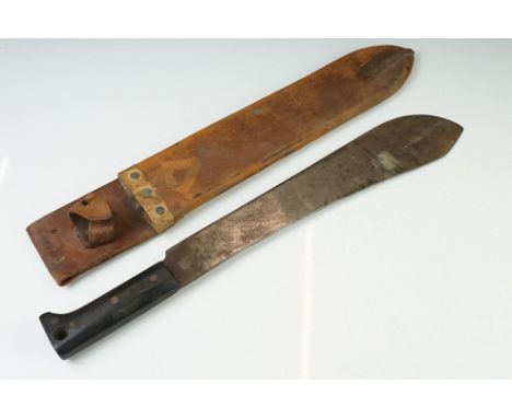 A British military issued World War Two machete with leather scabbard, dated 1944 and broad arrow marked. 