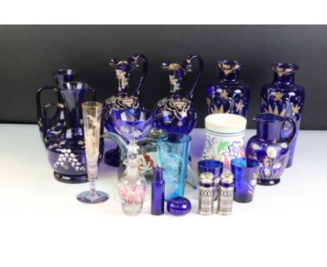 Pair of Murano Blue Glass Ewers with gilt and enamel floral decoration, 21cm high together with Pair of Blue Glass Vases with