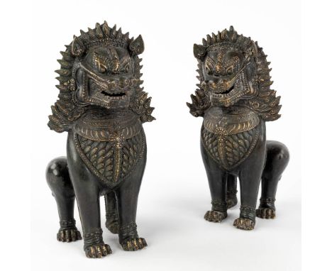 A pair of Thai Temple Guards, patinated bronze. 20th century.  (L: 14 x W: 12 x H: 27 cm)