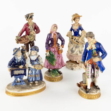 An collection of porcelain figurines. Marks by Volkstedt, Capodimonte.2 pairs and a small group.  (H: 23 cm)