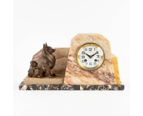 A mantle clock with a small dog, art deco.Onyx and spelter.  (L: 10,5 x W: 40 x H: 21 cm)