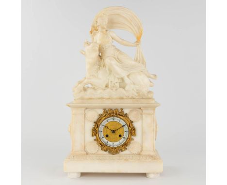 An alabaster mantle clock 'The Abduction of Europa'.Europa is being abducted by Zeus, in the shape of a white bull.Movement w