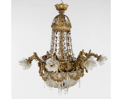 A large chandelier 'Sac ˆ Perles', bronze and glass. Decorated with mythological figurines and garlands. Circa 1900.   Missin