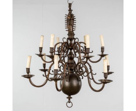 A Flemish candle chandelier, crowned madonna with child, 12 points of light. Bronze. 19th century.The chandelier has been adj