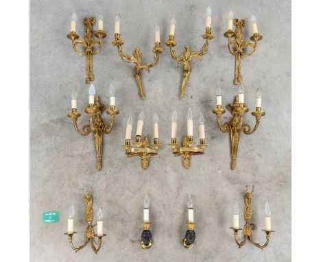 A collection of 6 pairs of wall lamps in Louis XVI, Louis XV and empire style. 20th century.Bronze and brass.  (H: 42 cm)