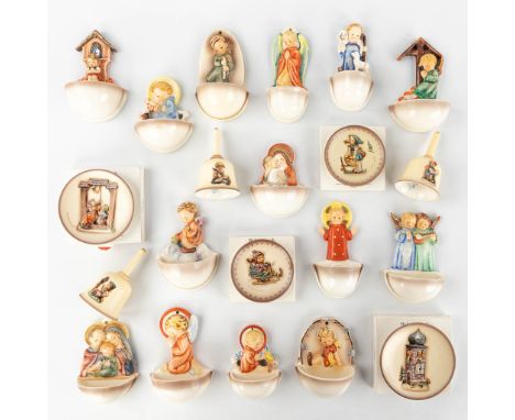 Hummel, a collection of 14 holy water fonts, 4 plates and 3 bells.  (H: 13,5 cm)