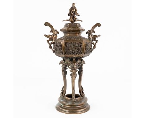 An antique Oriental incense burner, bronze. Figurine depicting a man seated on a bird.  (L: 14 x W: 22 x H: 41 cm)