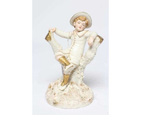 A ROYAL WORCESTER PORCELAIN FIGURE, 1889, modelled by James Hadley as a young boy in Kate Greenaway style garb, seated on a t