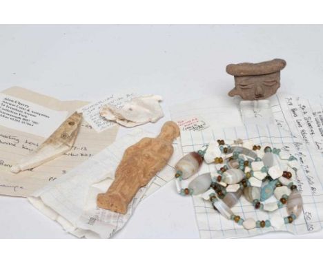 A COLLECTION OF ANTIQUITIES comprising of a pre Columbian Mexican head, a meso bone tool, a terracotta figure of the Roman go