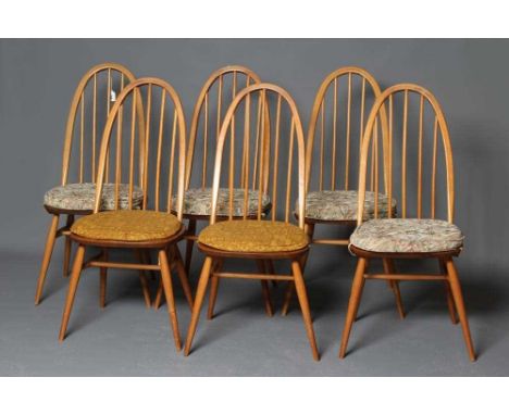 A SET OF SIX ERCOL MODEL 365 QUAKER DINING CHAIRS, in blond beech and elm, with loose cushions, maker's label, 16" x 16" x 38