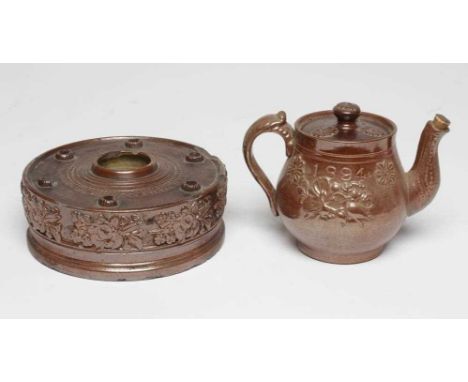 A DOCUMENTARY BROWN SALTGLAZE STONEWARE CIRCULAR INKWELL, 1861, the central cylindrical well with ribbed rim and impressed 'W