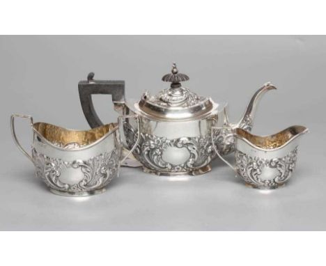 A BACHELOR'S EDWARDIAN SILVER COMPOSITE THREE PIECE TEA SERVICE, maker possibly E G Parker, Birmingham 1903 (milk jug) and 19