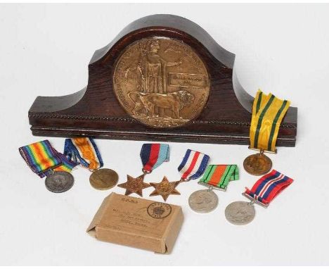 THE MEDALS AND DEATH PLAQUE OF THREE BROTHERS, comprising a Territorial War Medal and death plaque in a presentation oak stan