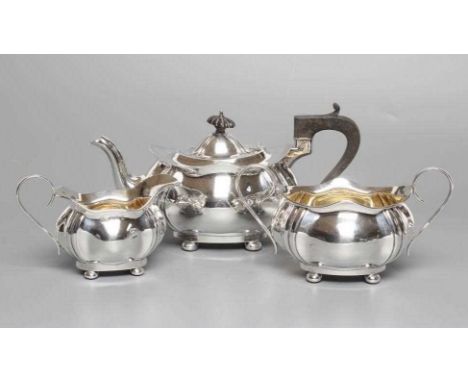 A SILVER THREE PIECE TEA SERVICE, maker Joseph Gloster Ld., Birmingham 1922, of lobed oval baluster form raised on four bun f