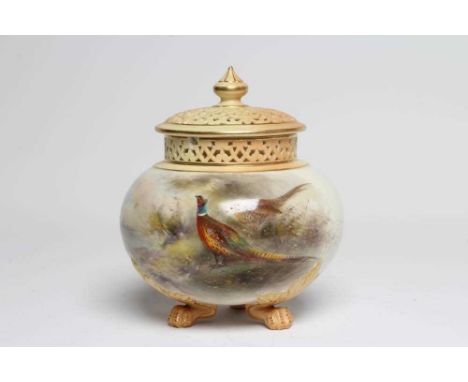 A ROYAL WORCESTER PORCELAIN POT POURRI AND COVERS, 1911, of squat lobed globlar form raised upon three paw feet, painted by J