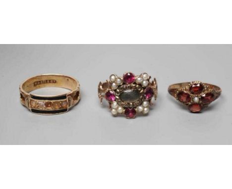 THREE MOURNING RINGS, comprising a late George III almandine garnet, seed pearl and hair panel ring, William Talbot died 1819