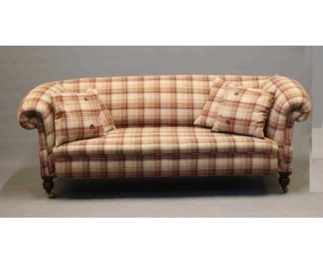 A VICTORIAN WALNUT FRAMED CHESTERFIELD SOFA, upholstered in wool tartan, raised on turned legs with brass castors, 78" x 21 1