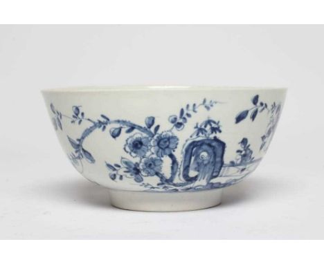 A FIRST PERIOD WORCESTER PORCELAIN BOWL, c.1755-60, painted in underglaze blue with the Prunus Fence pattern, workman's mark,