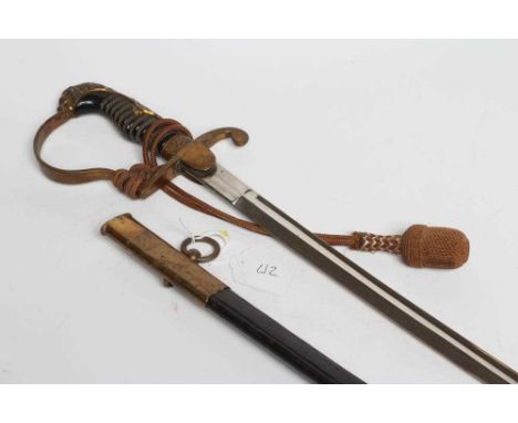 A GERMAN CAVALRY OFFICER'S SWORD, the 30 3/4" curved blade stamped "ADOLF BRAUN BERLIN", brass hilt with acorn decoration, li