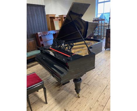 A LATE VICTORIAN C BECHSTEIN BOUDOIR GRAND PIANO, in ebonised case with shaped and scroll pierced music stand, raised on turn