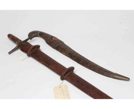 A SUDANESE KASKARA SWORD with 36 1/2" blade, cruciform hilt and leather scabbard, 43" long, together with a large Jambiya typ