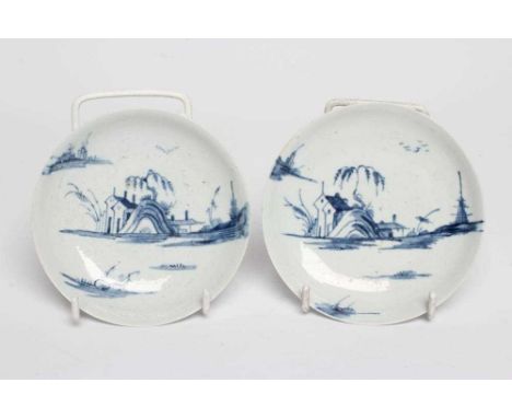 A PAIR OF LIVERPOOL PORCELAIN SAUCERS, POSSIBLY WILLIAM REID, 1756-61, painted in underglaze blue with a rim to rim landscape