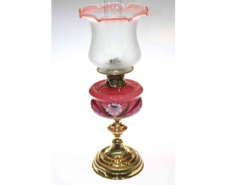 Brass oil lamp with flower painted pink opaque glass reservoir