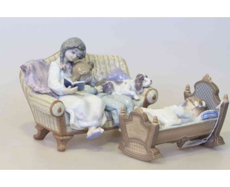 Two Lladro groups, children on sofa and child in crib