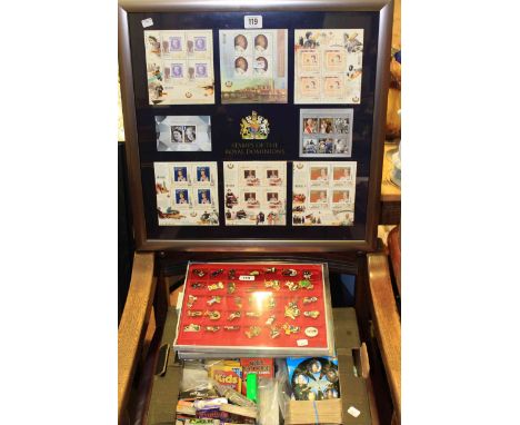 Framed stamps of The Royal Dominion, playing cards, golly and other badges etc.
