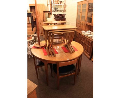 Teak circular extending dining table and four chairs, teak corner cabinet, nest of tables, magazine table, standard lamp and 