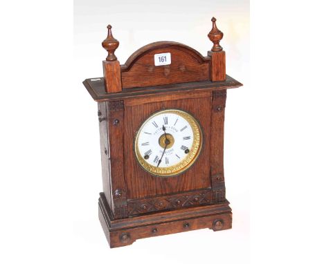 Oak mantel clock, the dial signed Fattorini & Sons