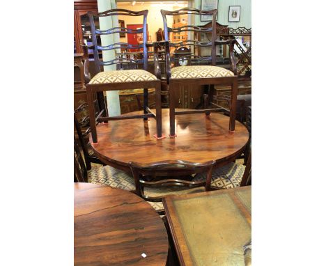 Victorian circular mahogany pedestal dining table on claw feet together with eight later pierced ladder back dining chairs