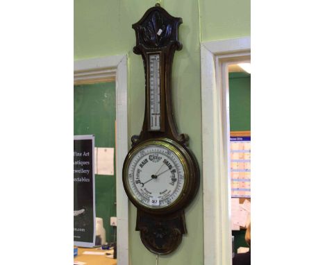 Carved mahogany barometer having enamelled dial