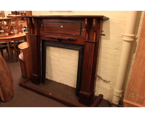 Mahogany and cast fire surround and mahogany fender