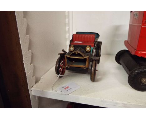 A Japanese vintage tin plate automobile, marked to back with patent numbers to base (A/F)