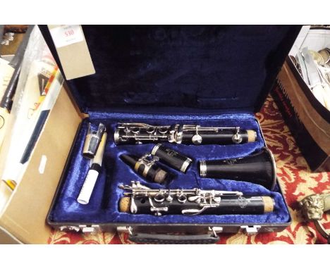 A clarinet housed in fitted case  