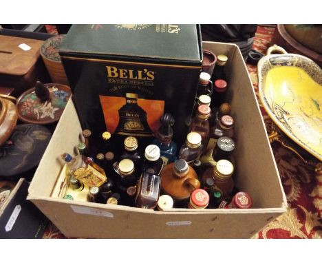 A mixed selection of miniature spirit bottles to include cherry brandy, Carlsberg, Bells etc, together with a boxed Bell's de