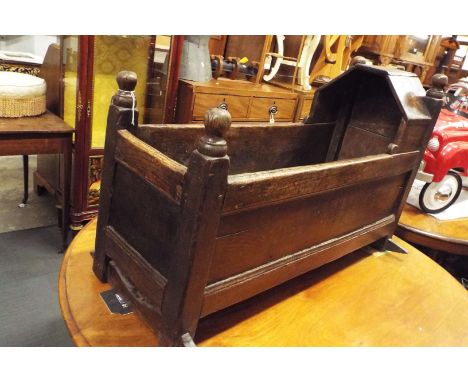 An early 18thC oak joint panel crib