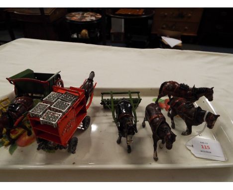 A lead and die-cast milk float, horse drawn roller and horse and cart