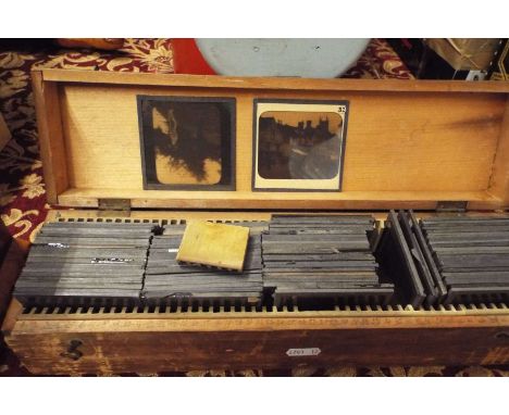 A box of glass plate negatives of various scenes to include local interest (Hastings Pier etc), agricultural, locomotive, arc