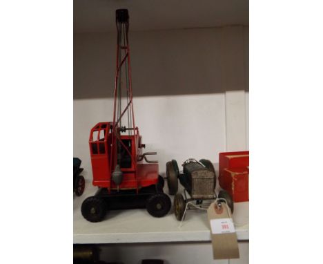 A 1950's Tri-ang K.L. 44 Jones crane and a tin-plate tractor