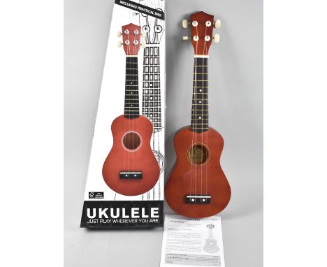 A New and Unused Ukulele with Bag and Instruction Leaflet 